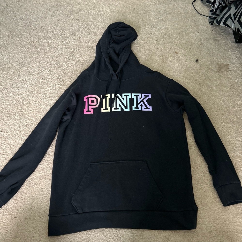 It’s a black hoodies brand it’s pink it has blue pink purple yellow green in it